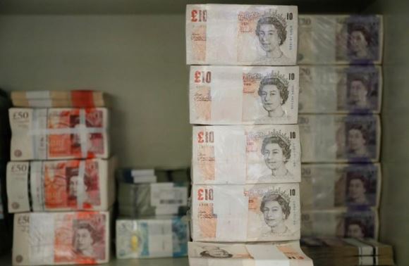 Pound steadies after May's Brexit deal voted down