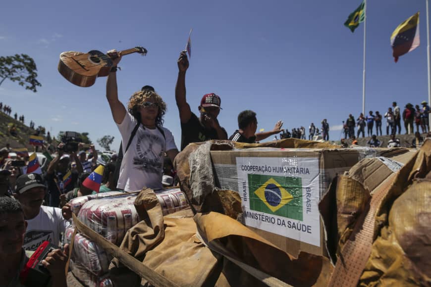 Venezuela's Juan Guaido says 'all options open' after Maduro's troops block aid, leaving two dead