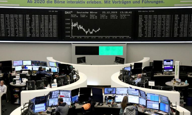 European shares hover near record high in thin holiday trade