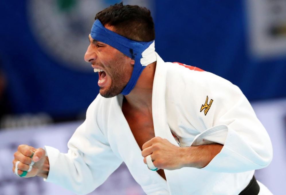 Iran judoka pressured not to fight Israeli, refuses to return home