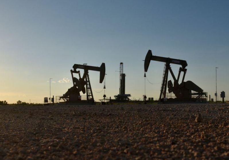 Oil near flat as Russia needs time to mull more OPEC+ supply cuts