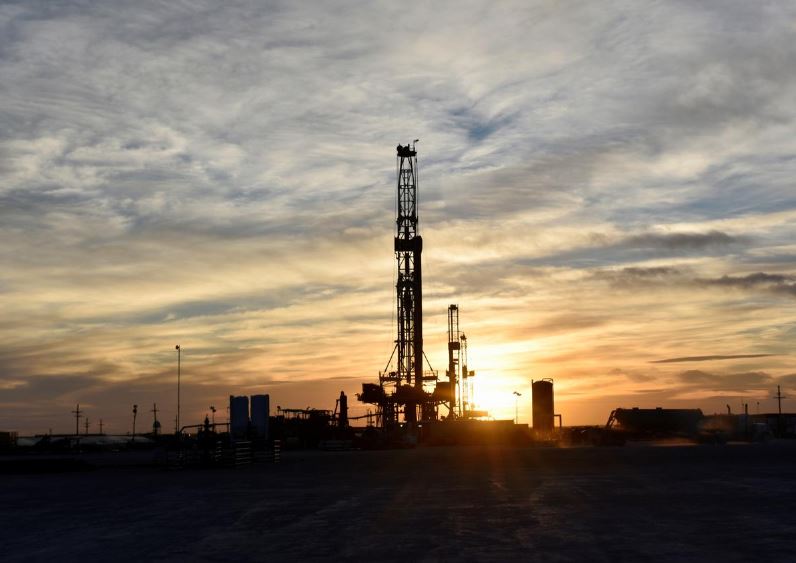 Oil prices rise from 13-month low as new virus cases slow