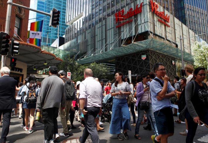 Australia government downgrades outlook for economy, budget surplus