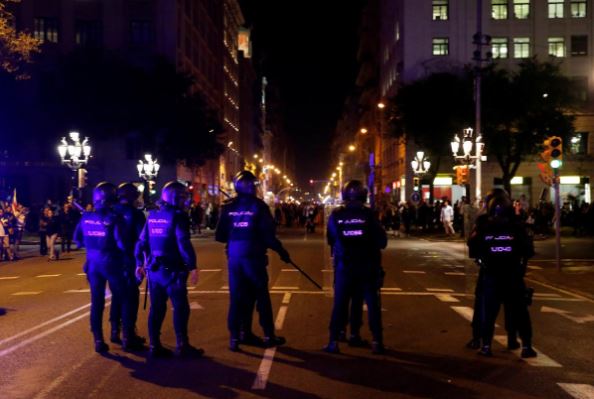 Spain jails Catalan separatist leaders, sparking protests, clashes