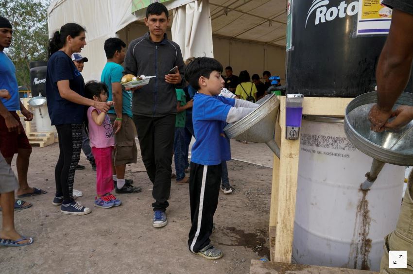 Venezuelan migrants quarantined in crowded shelters as they return home