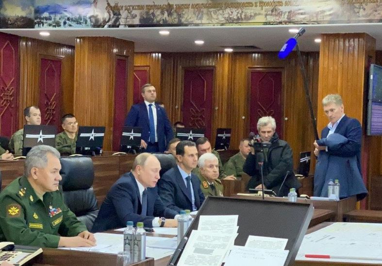 Russia's Putin makes rare visit to Syria, meets Assad